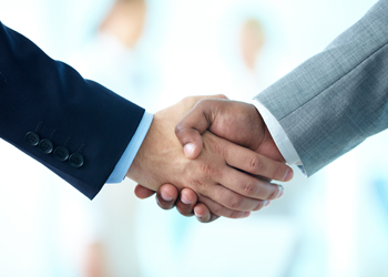 Photo of Handshake of Business Partners